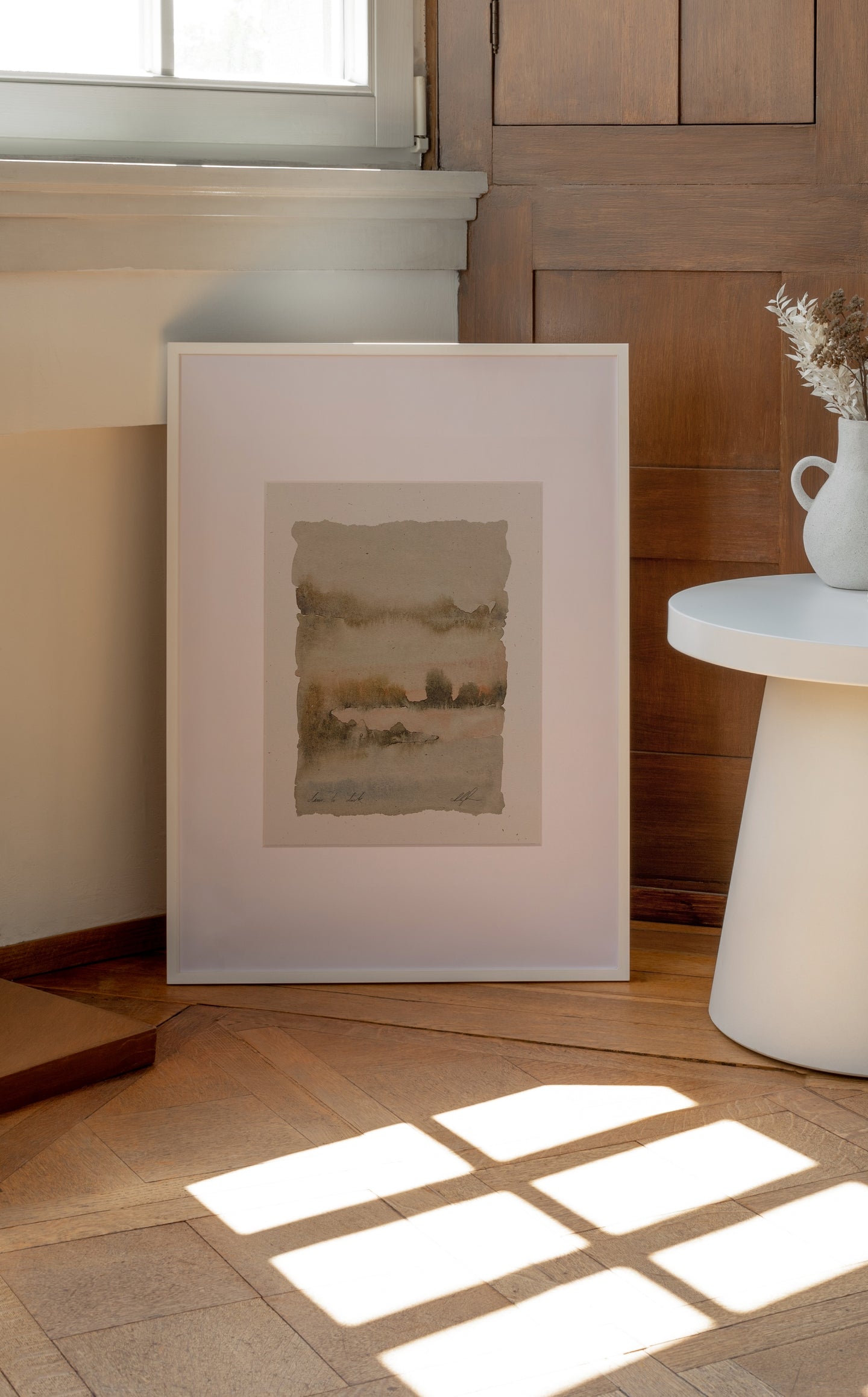 8.5x11 framed watercolor landscape print displayed upright against wall.