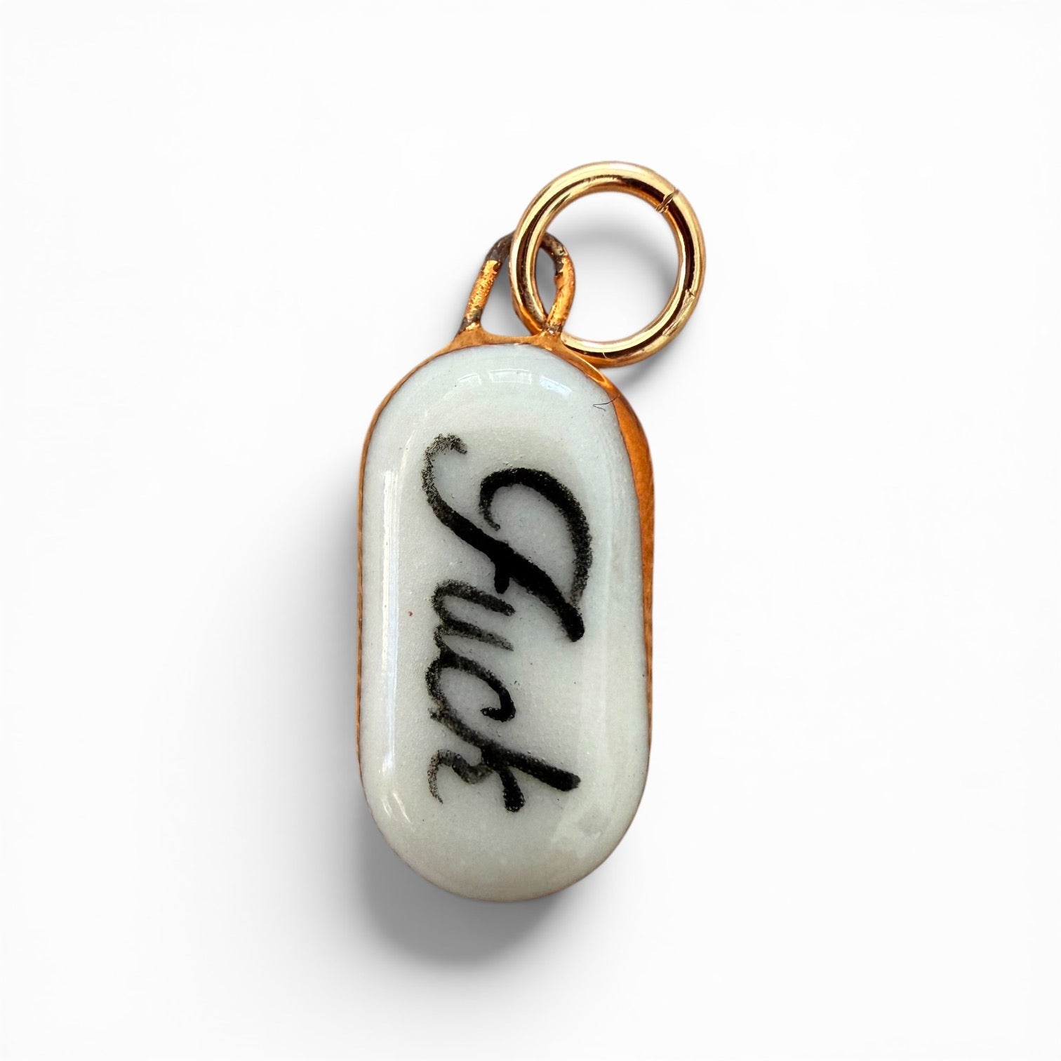 Porcelain charm, black "fuck" lettering, gold ring bail