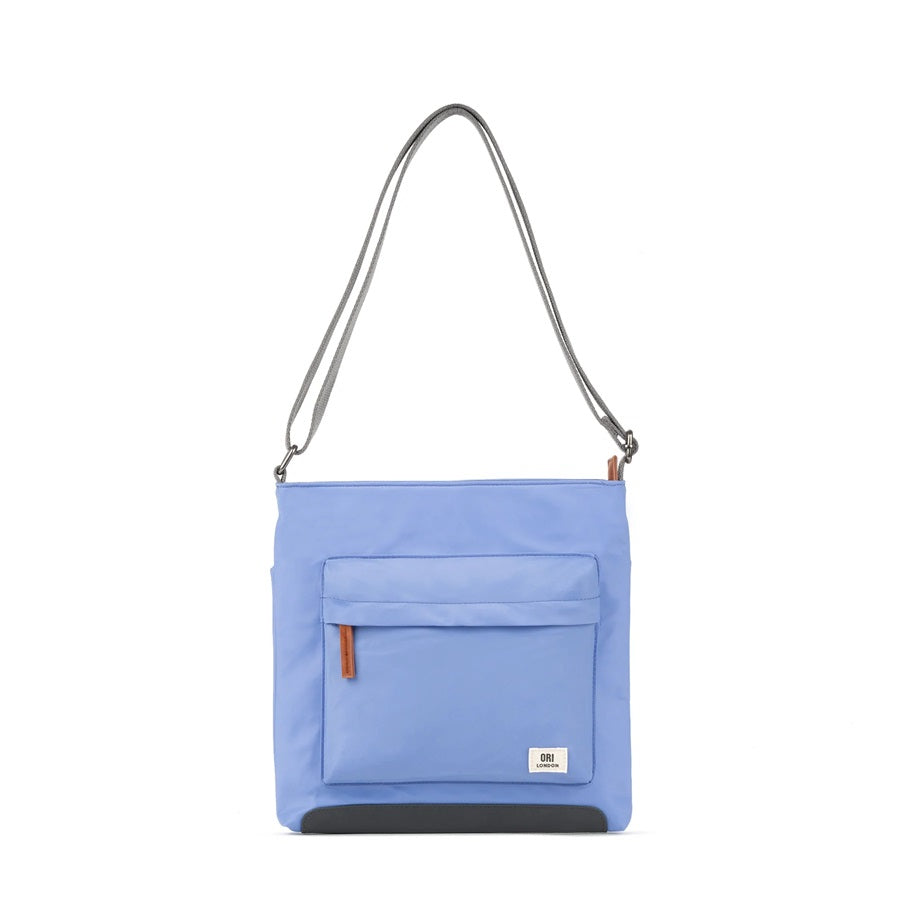 Sustainable nylon crossbody bag in light blue with zip front pocket