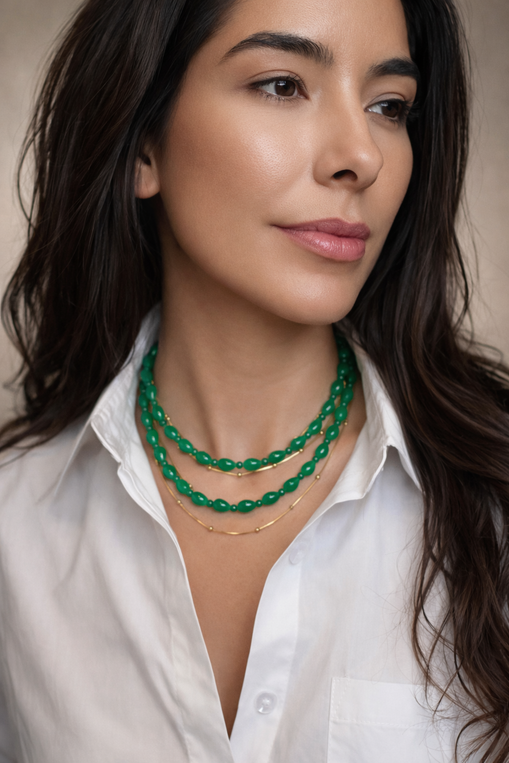 Gold satellite-link chain necklace on model, two short layers with small round links