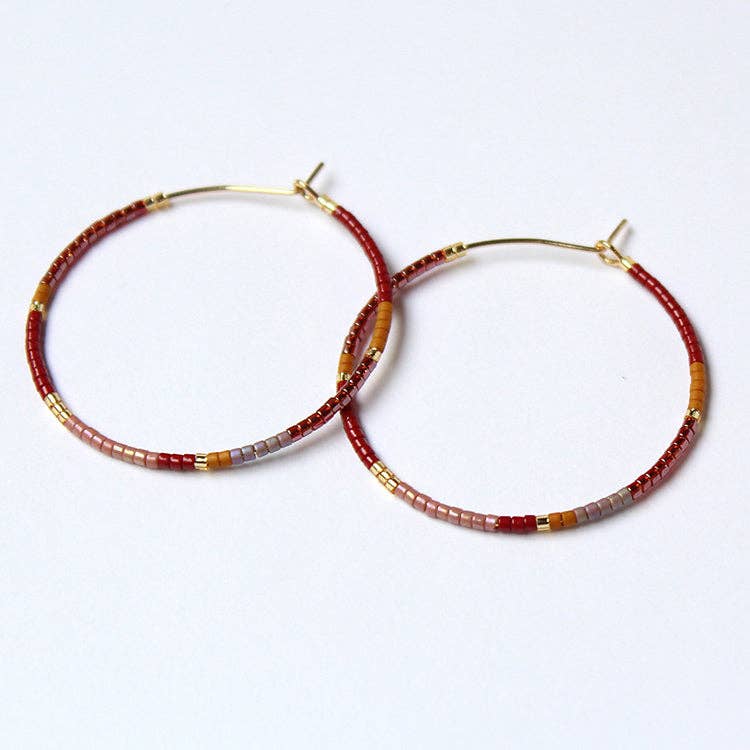 Beaded hoop earrings, gold-tone hoops with red, brown, gray and gold bead accents.