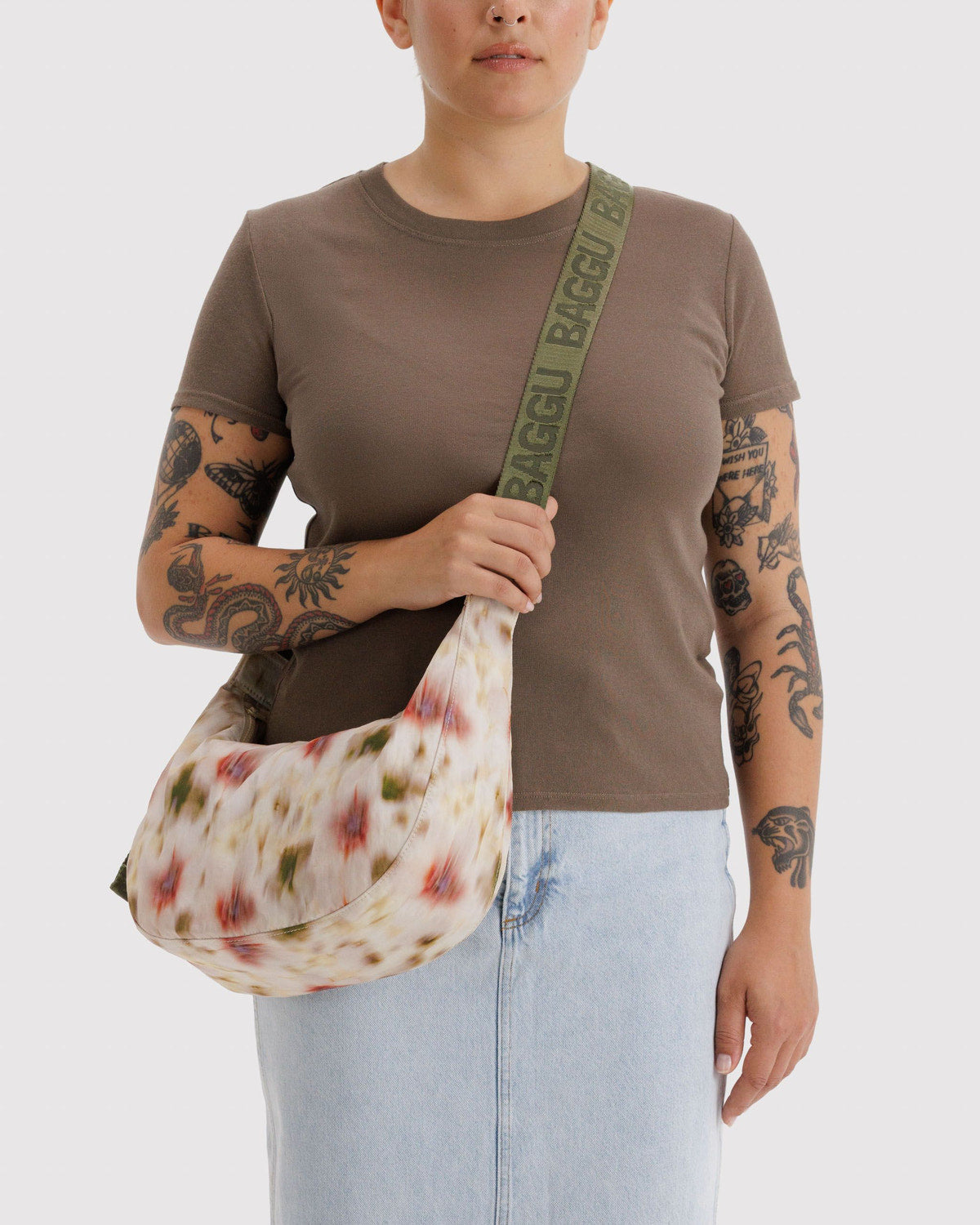 Medium crescent nylon bag, cream floral print with green logo strap