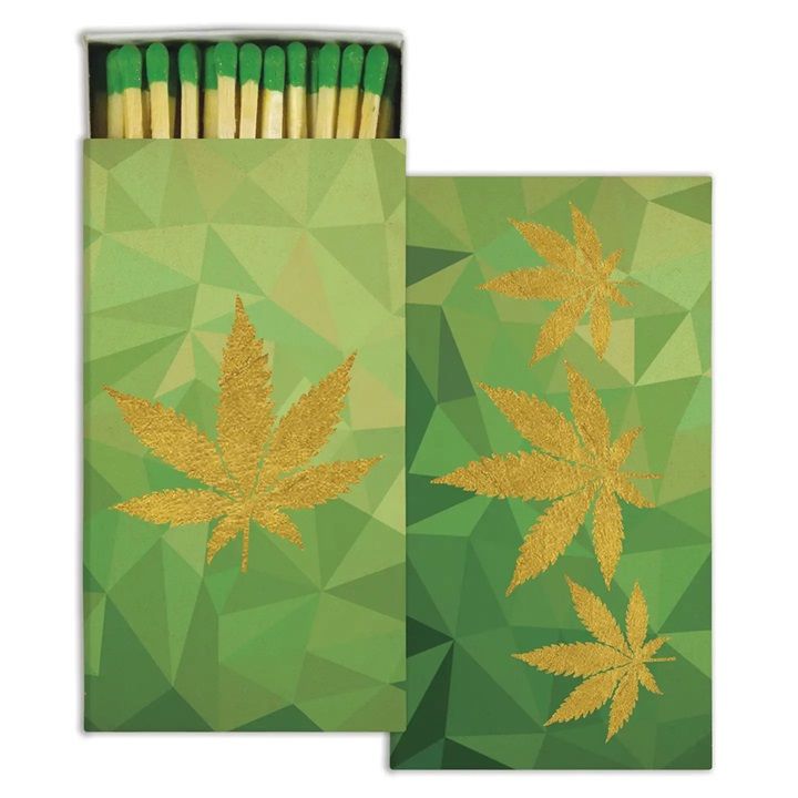 Green matchbox set with gold cannabis leaf print and green-tipped matches