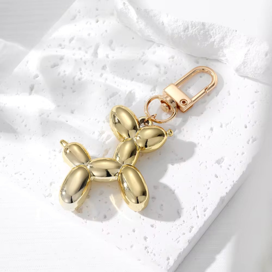 Gold metallic balloon dog keychain with gold clasp and split-ring attachment