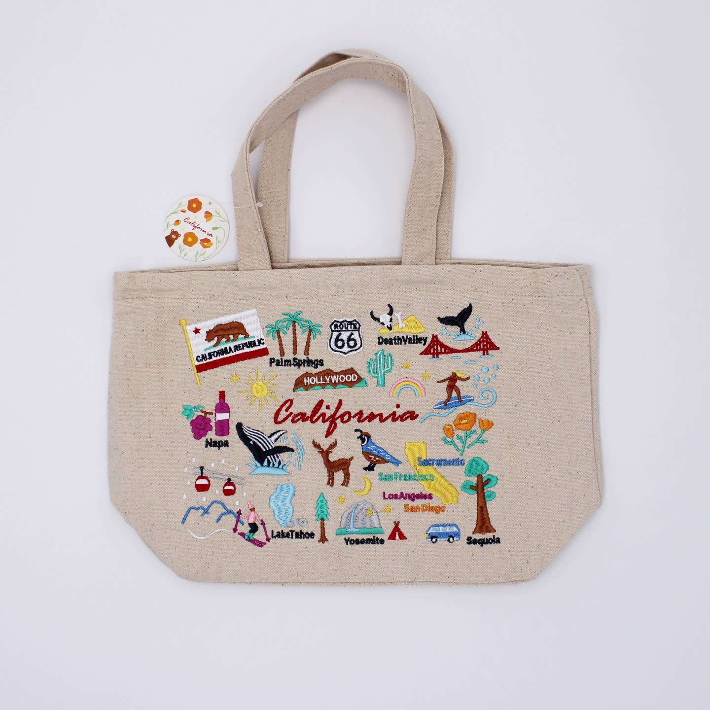 Embroidered California lunch bag, beige canvas with colorful map icons and handles
