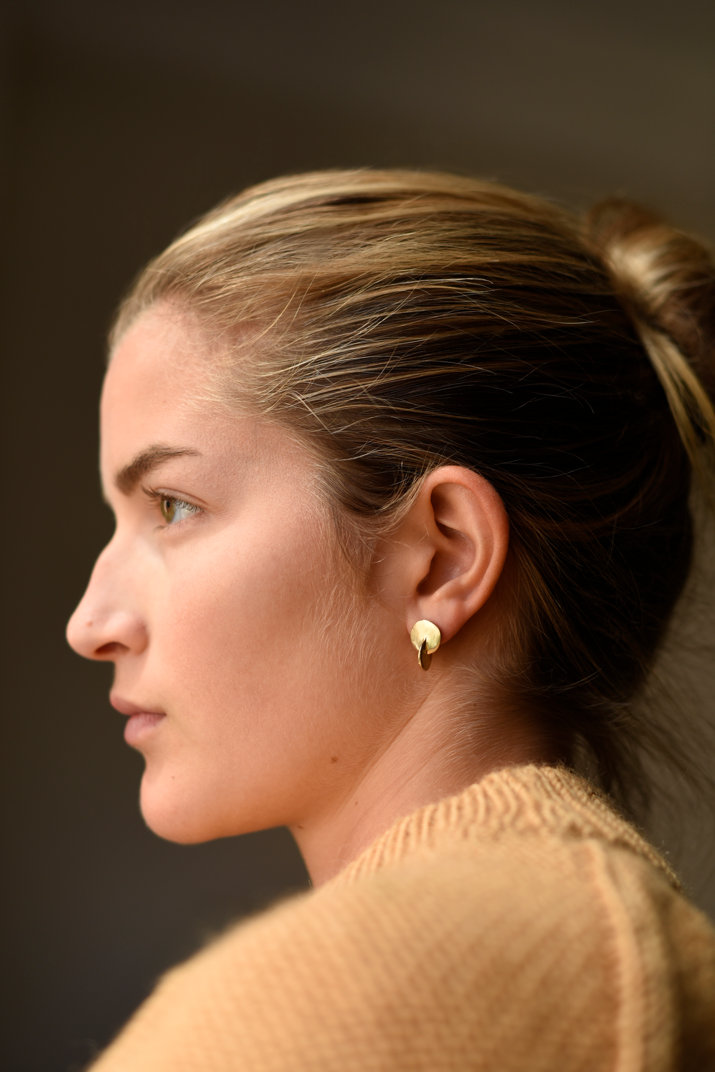 Brass round disc stud earrings, gold-tone, worn on ear with short post
