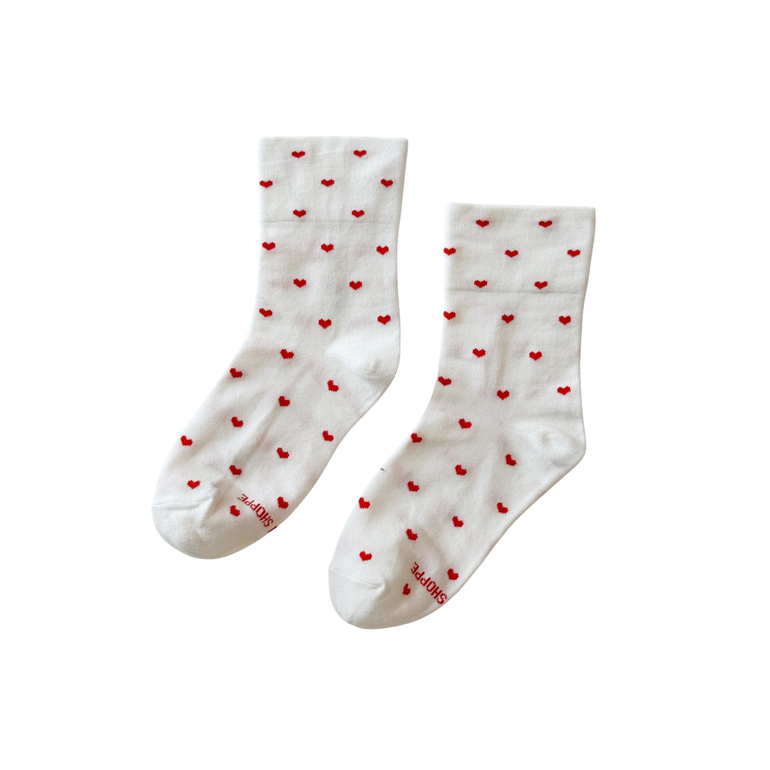 White sneaker socks with scattered red heart pattern