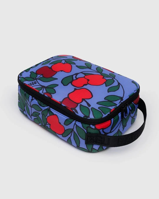 Blue lunch bag with red flower and green leaf print, zip top and carry strap.