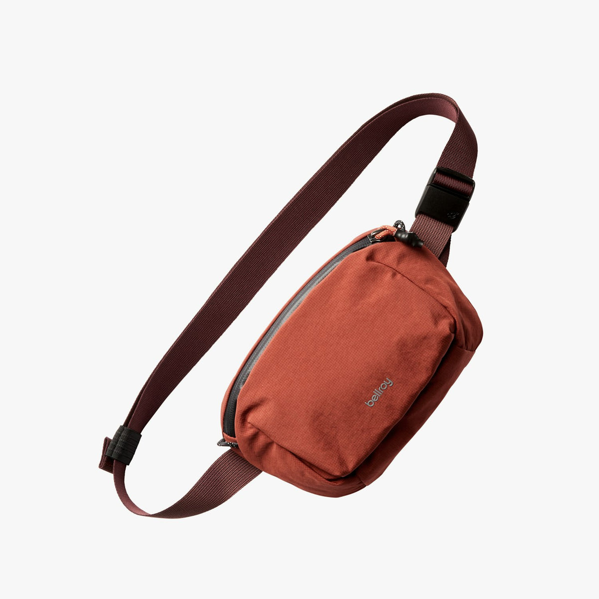 Clay orange belt bag with adjustable strap and front zipper pocket