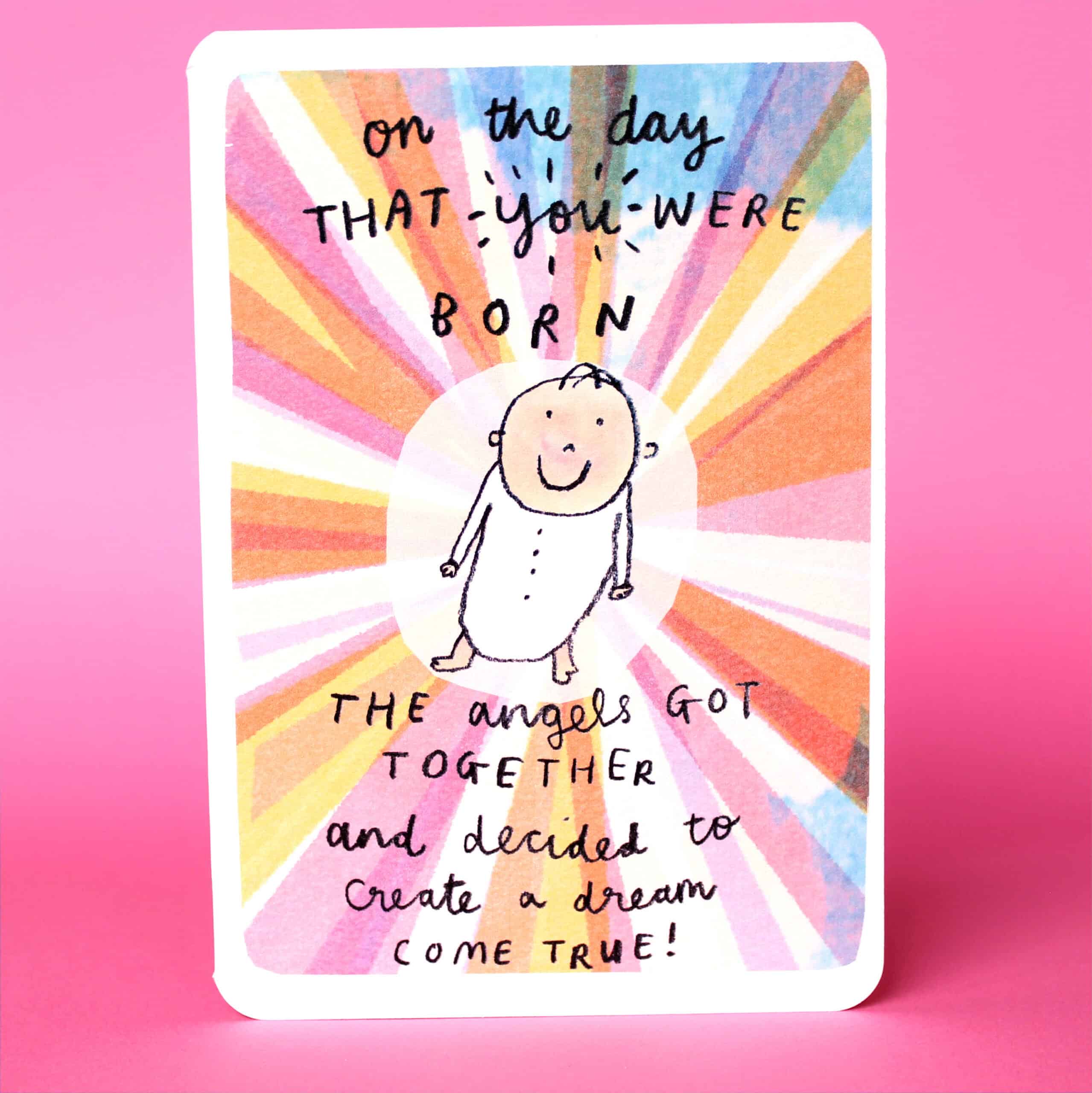 Greeting card with illustrated angel, colorful sunburst background, and birthday message.