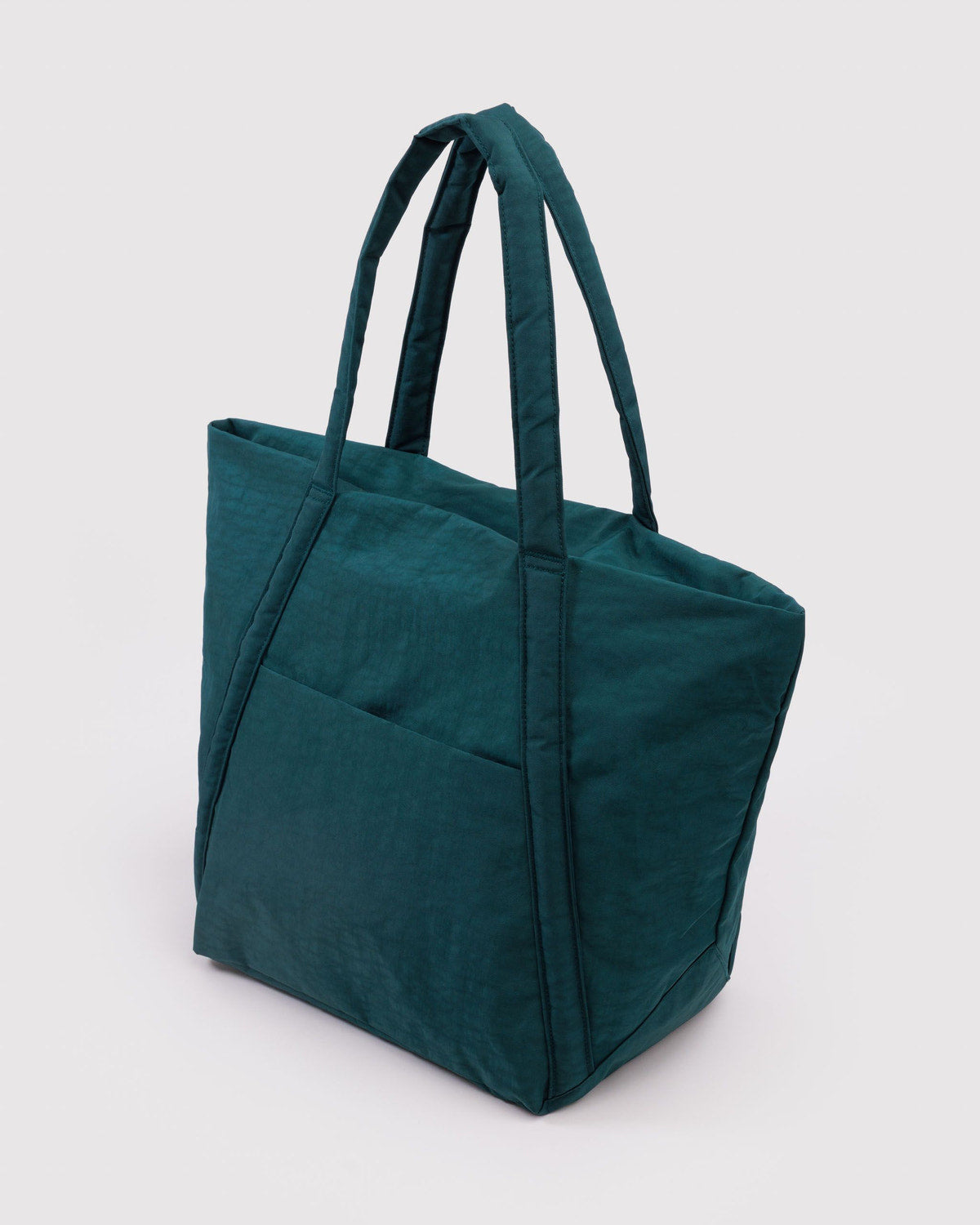 Teal tote bag with two top handles and boxy, reinforced corners.