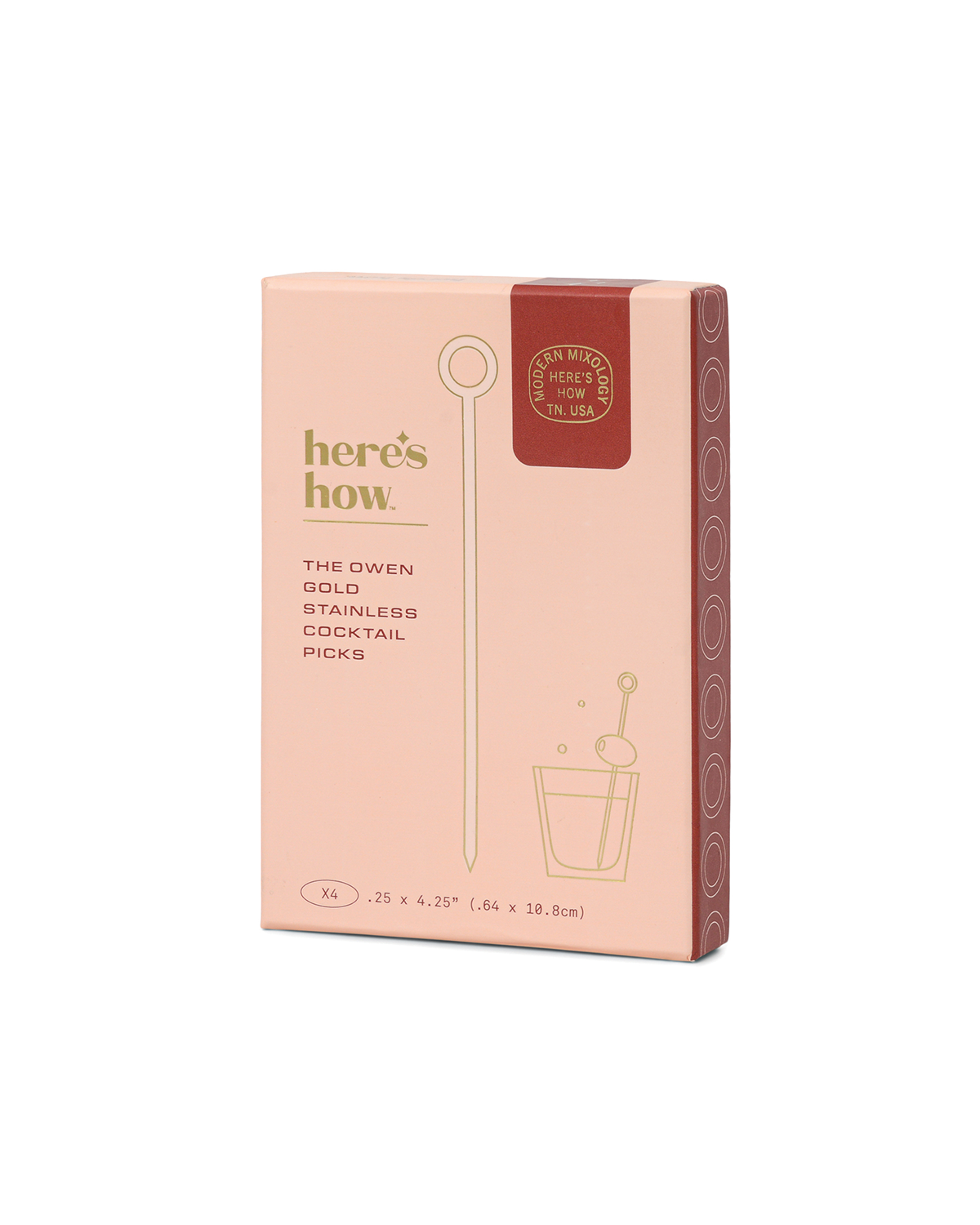 Boxed set of gold cocktail picks in pink packaging with hanging loop icon