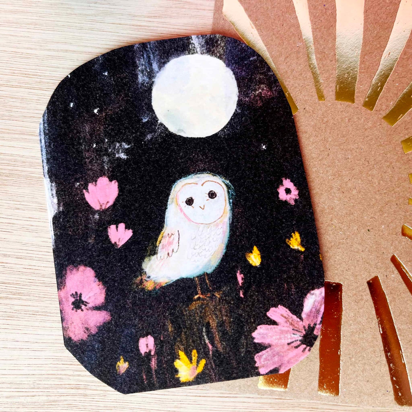 Little owl card with white owl on dark background, pink flowers and yellow butterflies