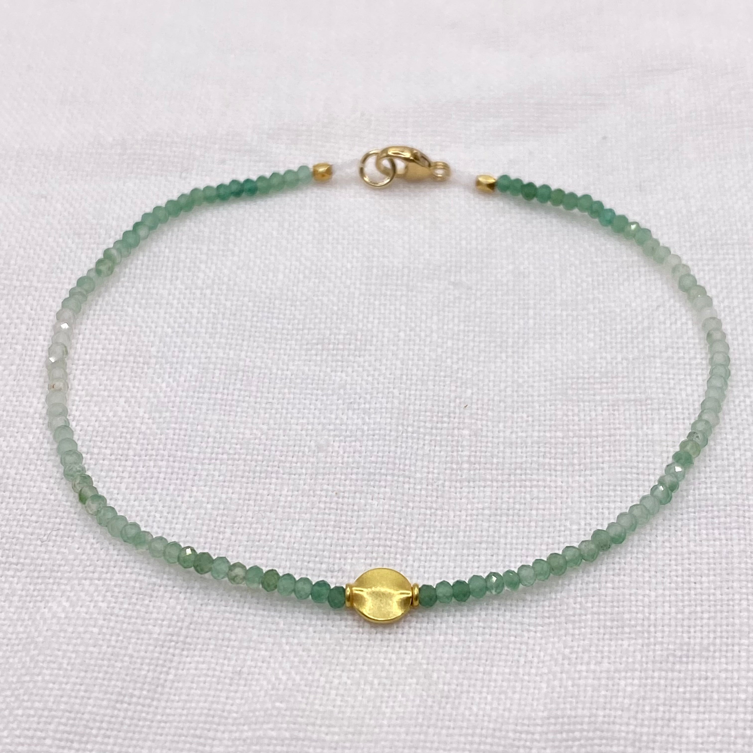 Aventurine bead bracelet with 18k gold clasp and small green faceted beads
