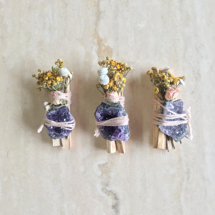 Palo santo bundle set with dried flowers and purple amethyst stones, three pieces.