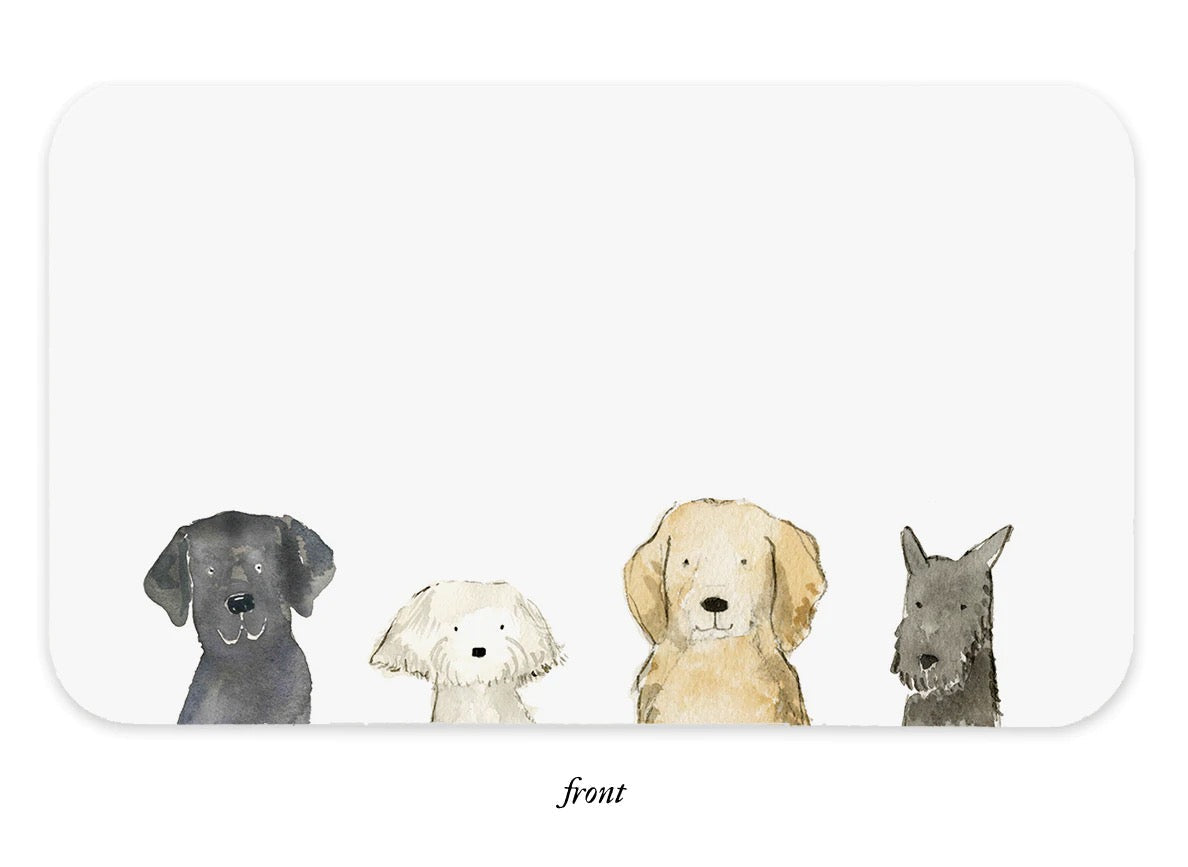 Dog-themed note pad front with four dog faces and blank writing area