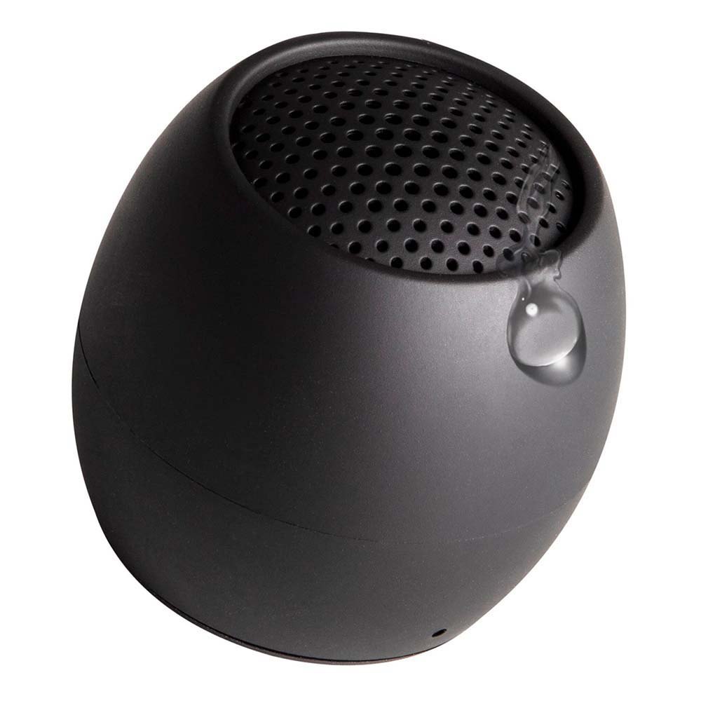Black mini wireless speaker close-up, textured top grille and side loop