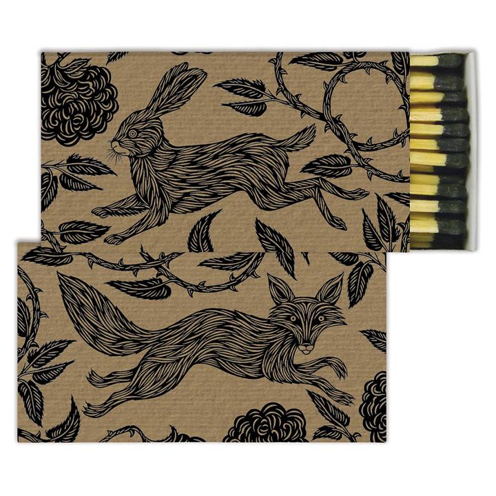 Folktail matchbook with rabbit and fox line art, beige with black print, holds matches.