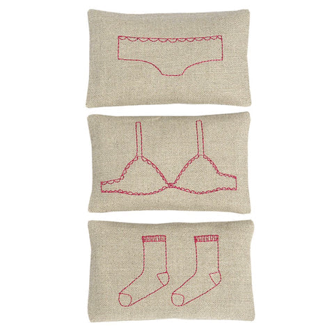 Beige fabric sachet set with red embroidered underwear shapes: shorts, bra, socks
