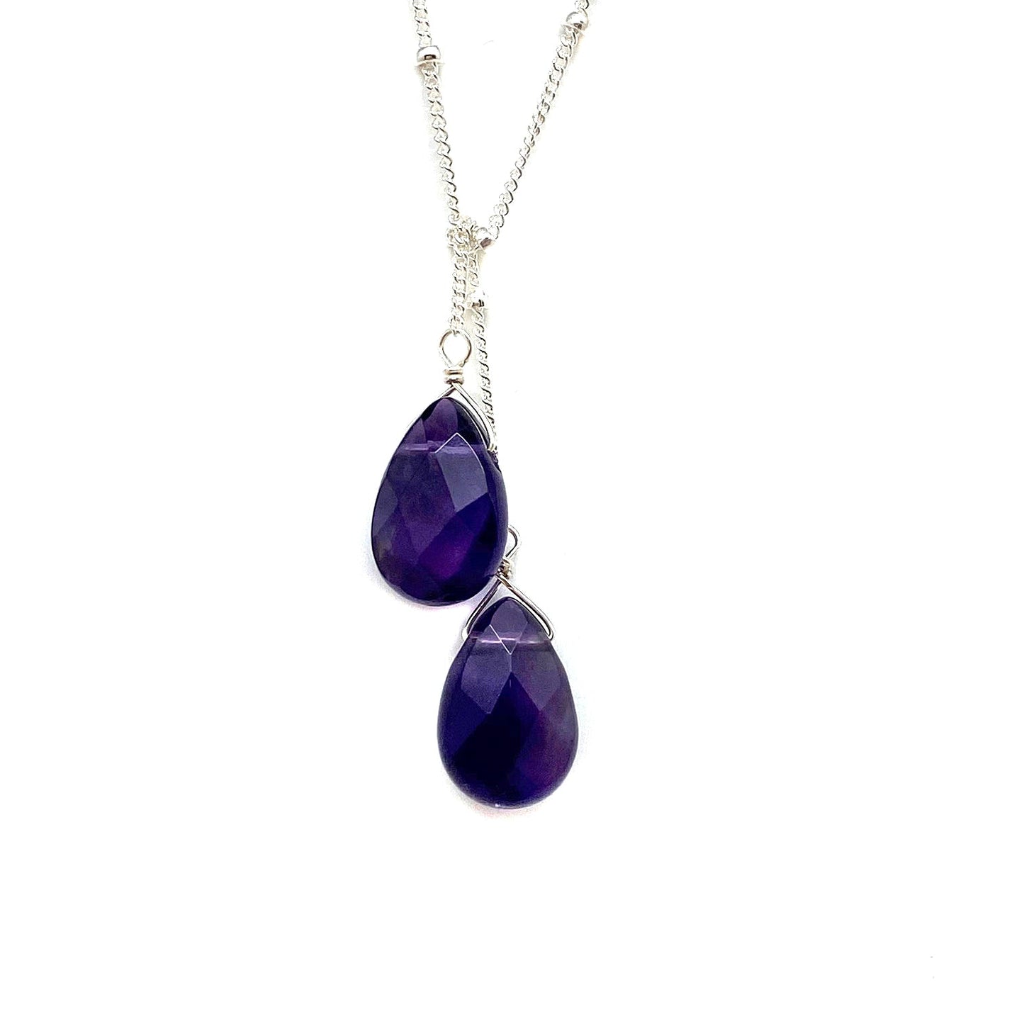 Sterling silver lariat necklace with two deep purple teardrop stones