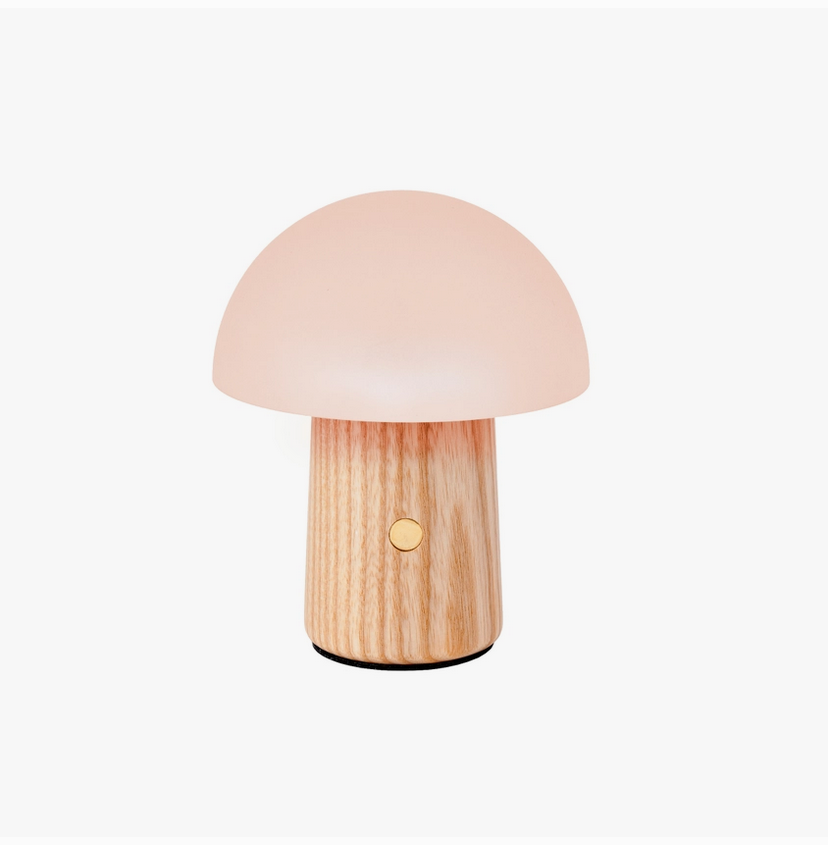 Mushroom table lamp with light wood base and warm white dome shade