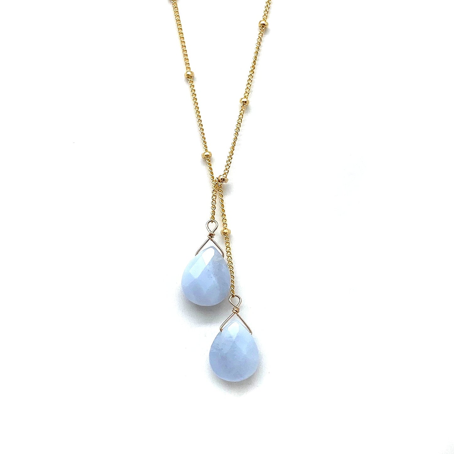 Gold-filled lariat necklace with two pale blue teardrop stone drops