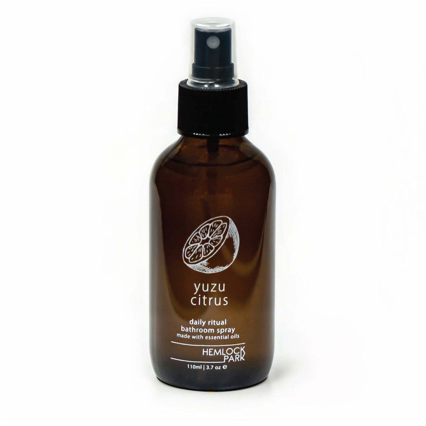 Room spray bottle with yuzu citrus label, amber glass, black mist nozzle and cap