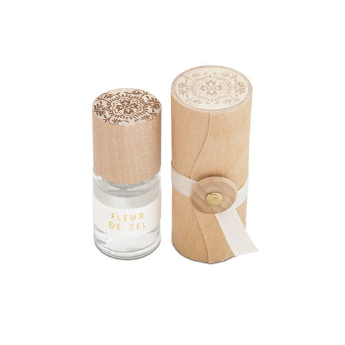 Fleur de sel rollerball perfume bottle with carved wooden cap and clear glass base