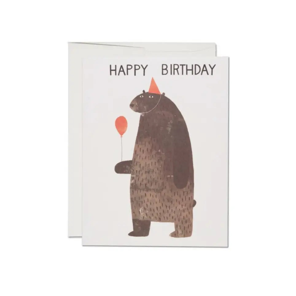 Birthday card with brown bear holding orange balloon and “HAPPY BIRTHDAY” text