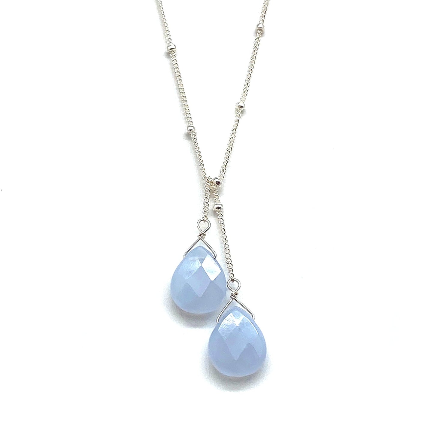 Sterling silver lariat necklace with two pale blue teardrop stones