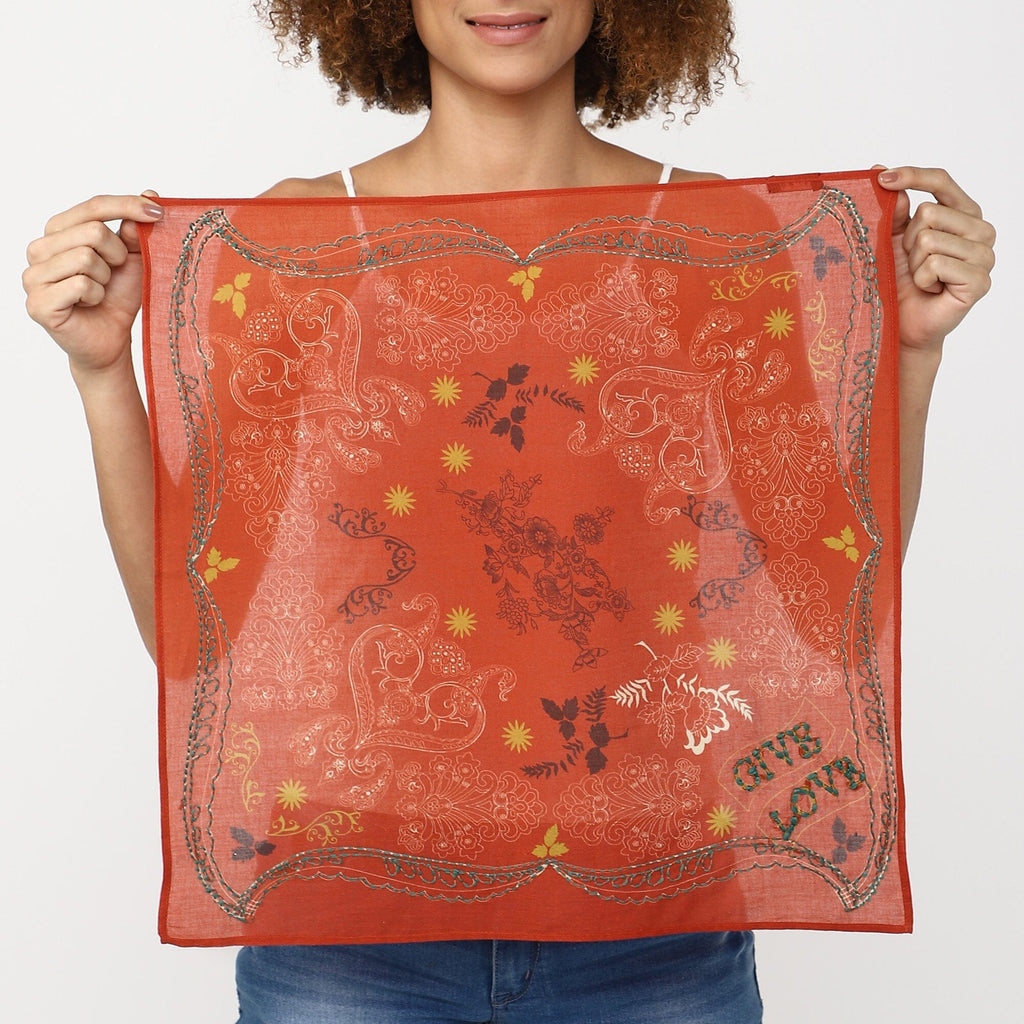 Orange embroidered bandana with multicolor floral paisley pattern and scalloped edge