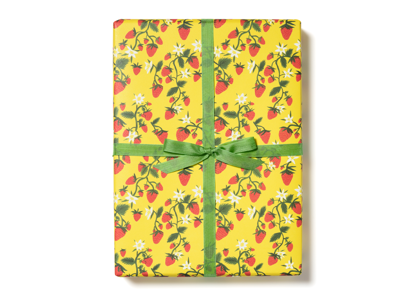 Floral strawberry gift wrap with green ribbon bow, yellow background