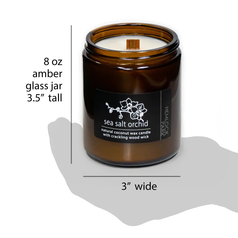 8 oz amber glass jar candle, sea salt orchid label, wood wick, 3 in wide