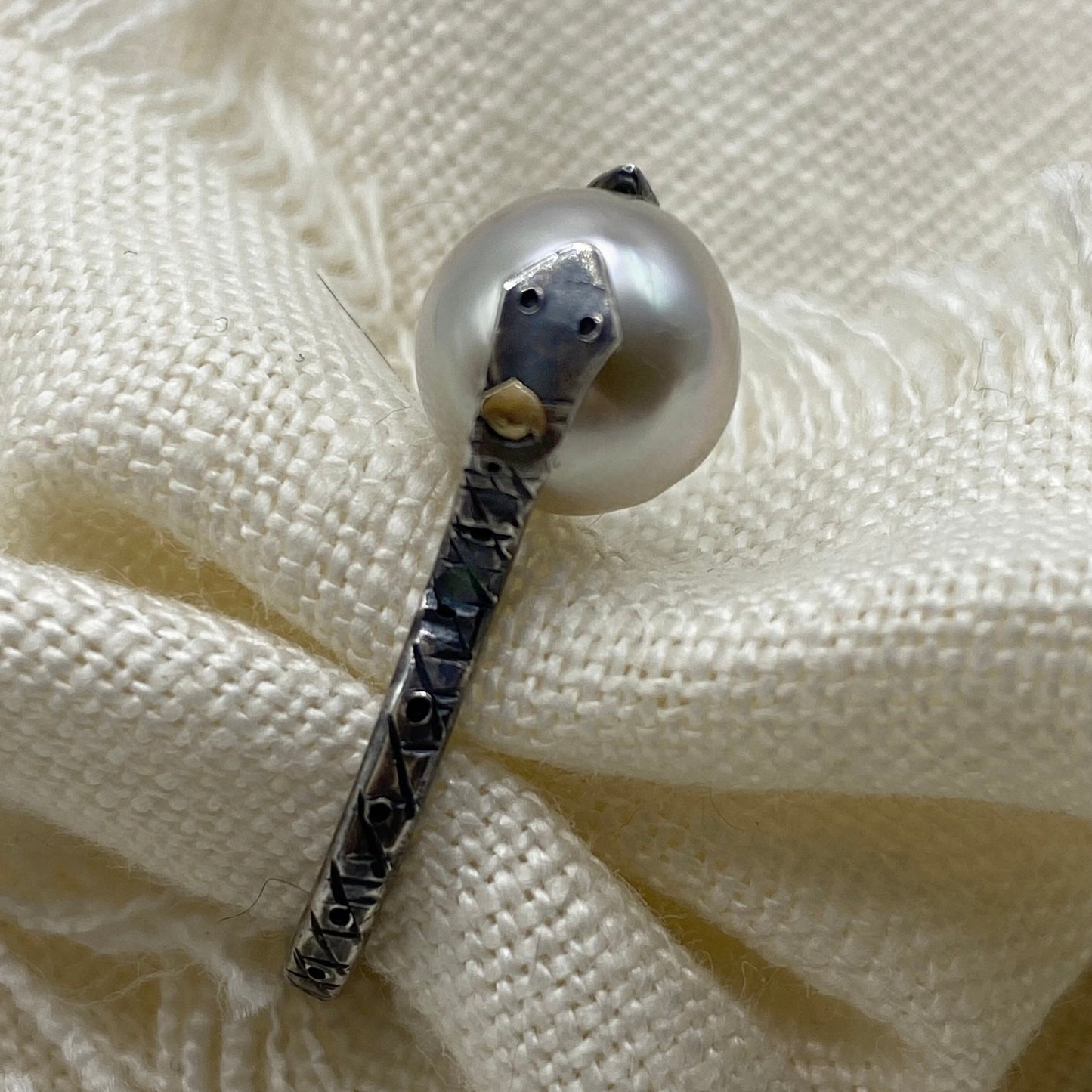 Sterling silver snake ring with large Tahitian pearl, dark engraved snake band detail