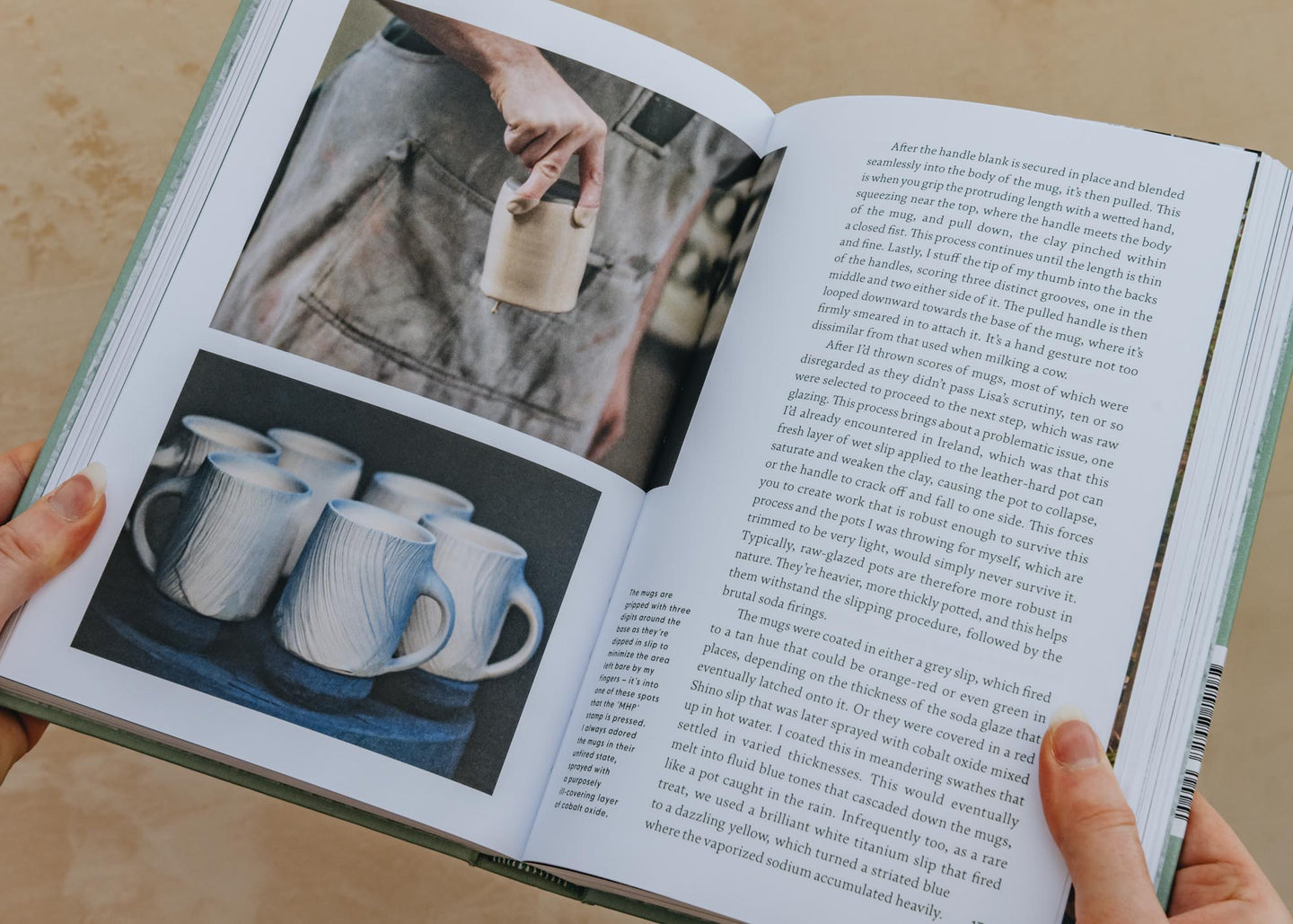 Open pottery book with color photos of cups on left page