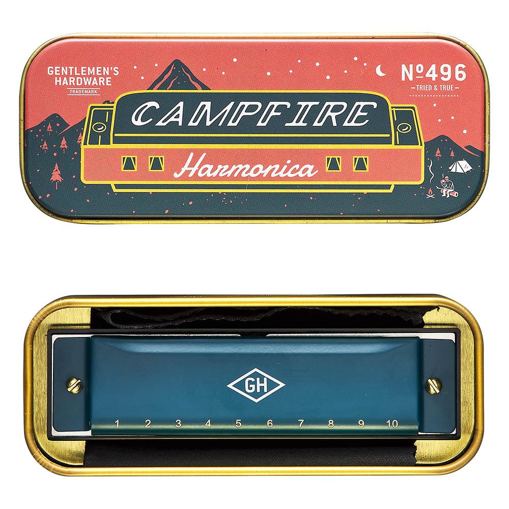 Decorated metal harmonica case with red, blue and gold camping-style artwork and badge