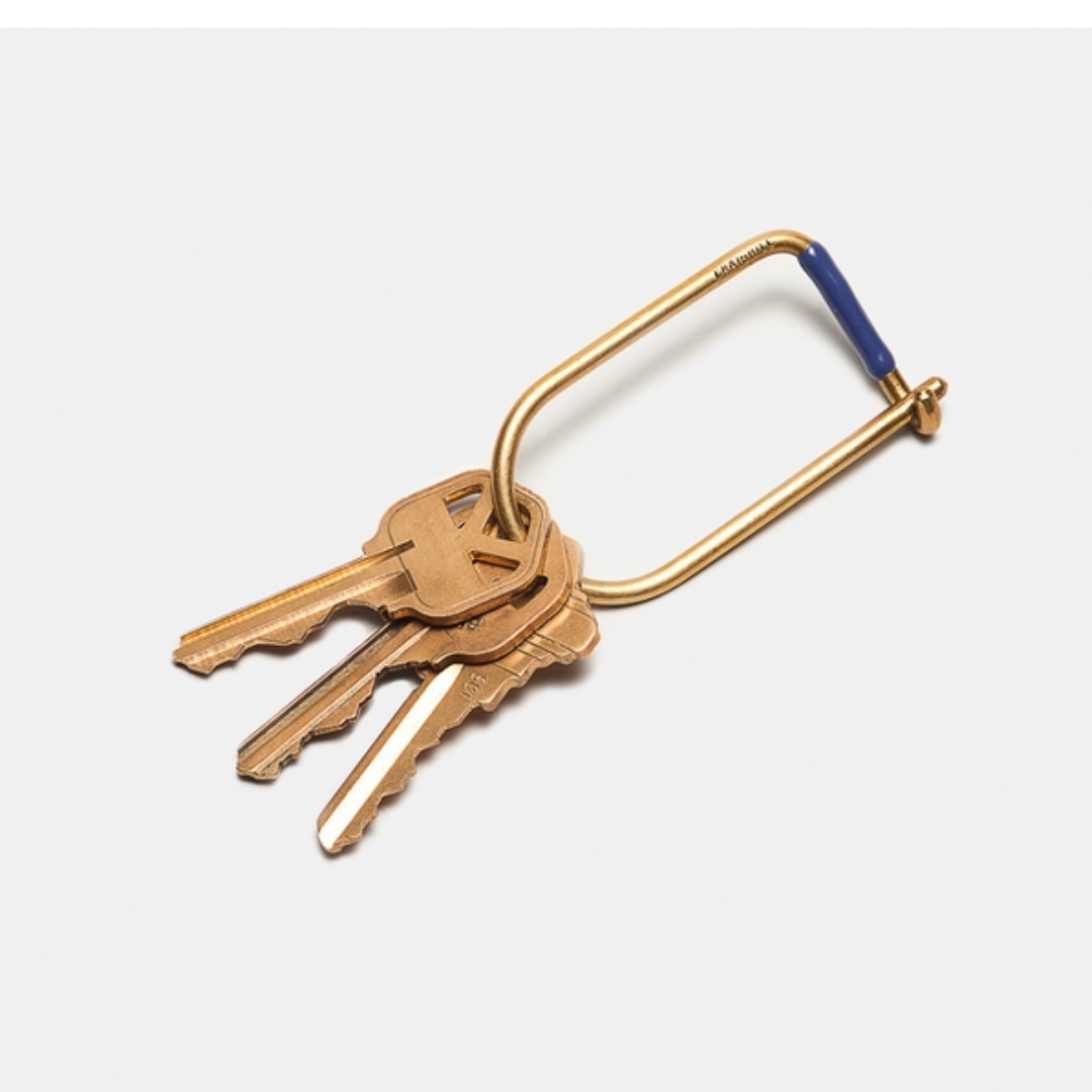 Gold-tone keyring with four keys and a U-shaped loop, blue end cap
