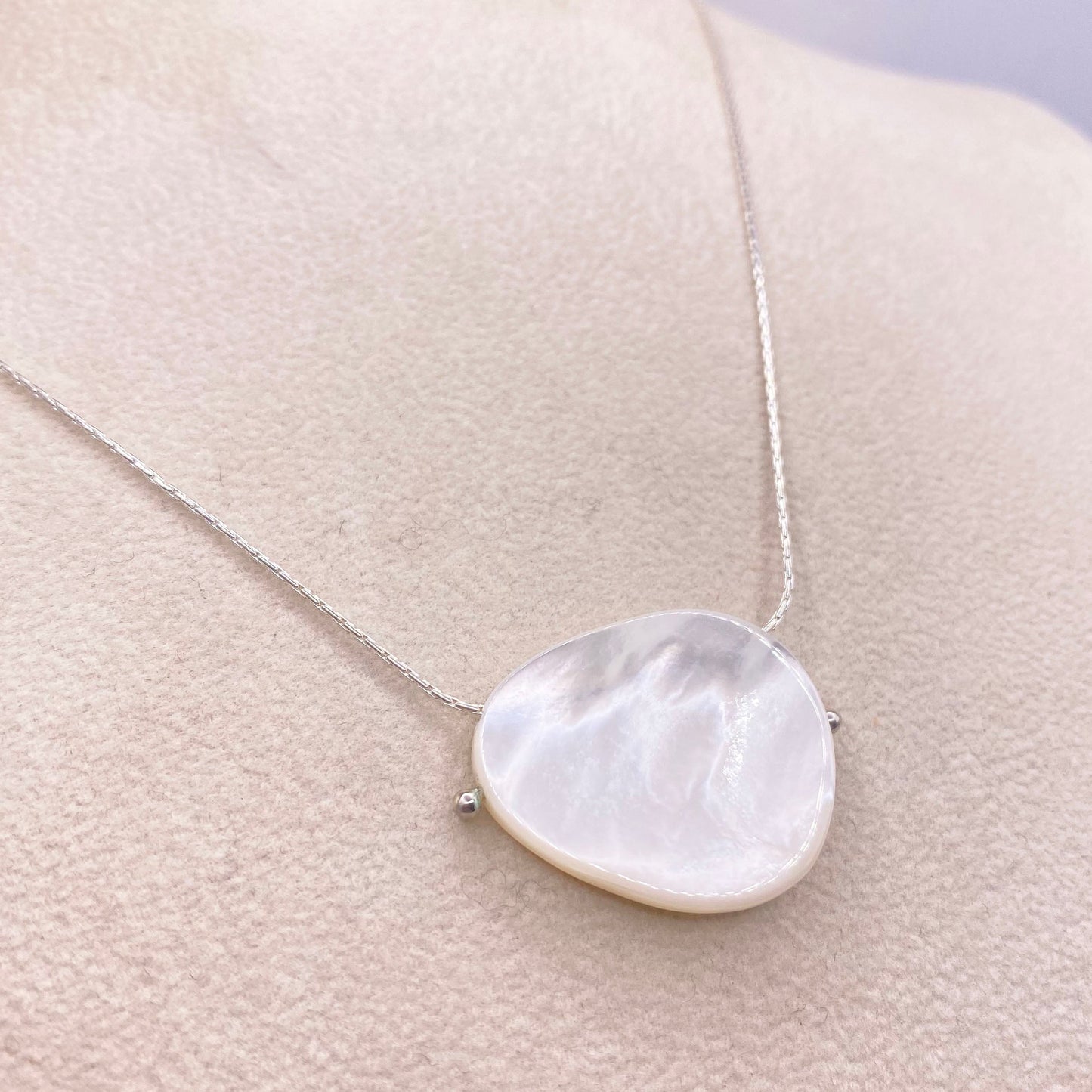Sterling silver chain necklace with large round mother-of-pearl pendant