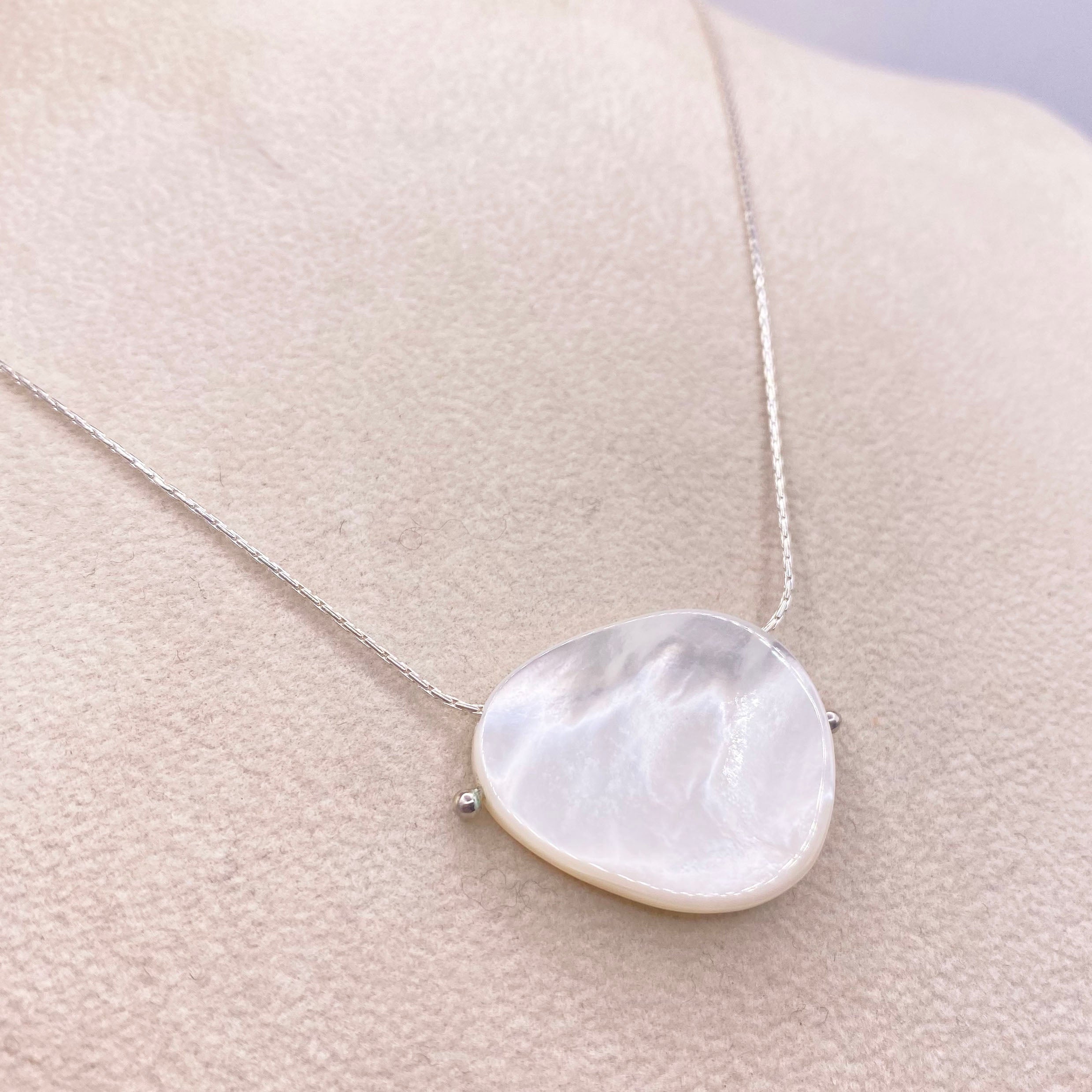 Sterling silver chain necklace with large round mother-of-pearl pendant