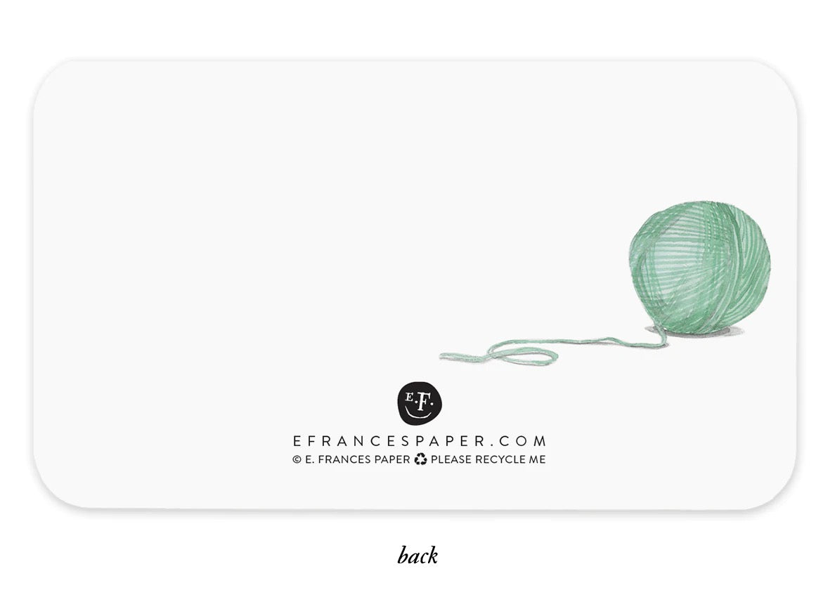 Back of cat note box with green yarn and E. Frances paper.com text