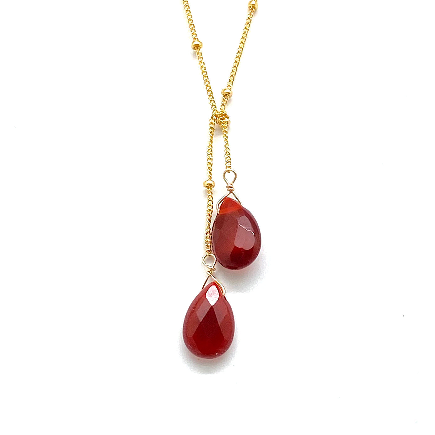 Gold-filled lariat necklace with two red teardrop stone drops