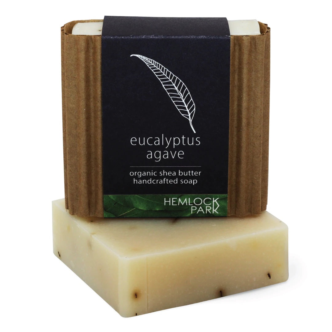 Eucalyptus agave organic shea butter soap bar, light cream color with dark label wrap