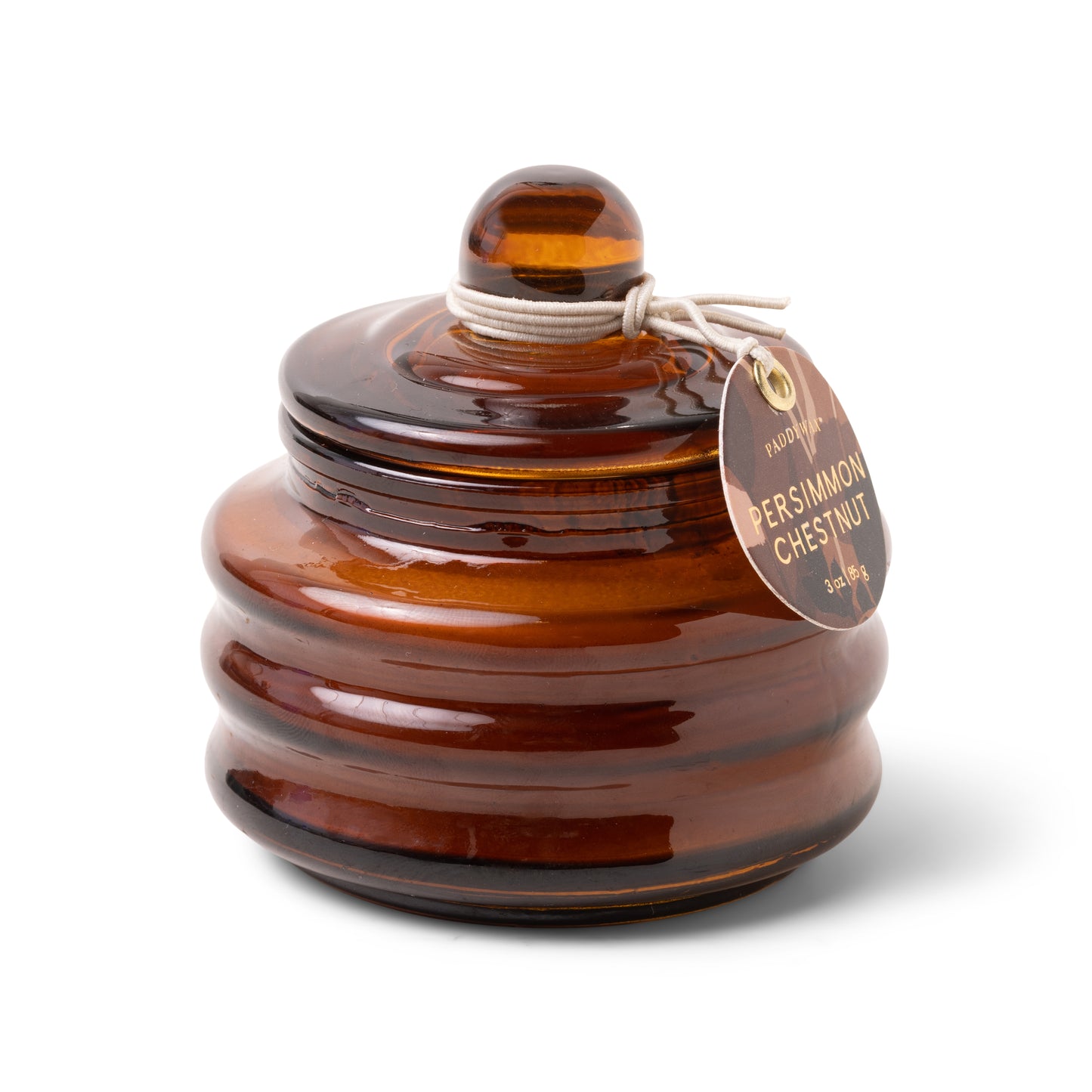 Beam candle in amber-brown glossy glass jar with round lid and hanging tag