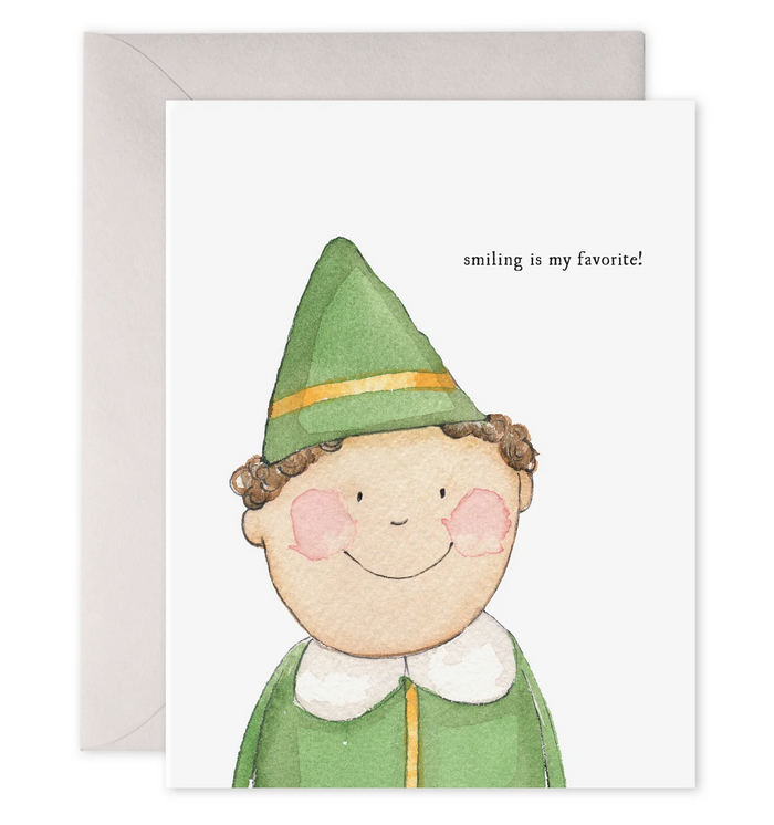 Smiling buddy holiday card with watercolor elf face in green hat; text reads “smiling is my favorite!”