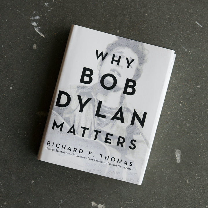 Book titled "Why Bob Dylan Matters" by Richard F. Thomas, white cover with bold black type