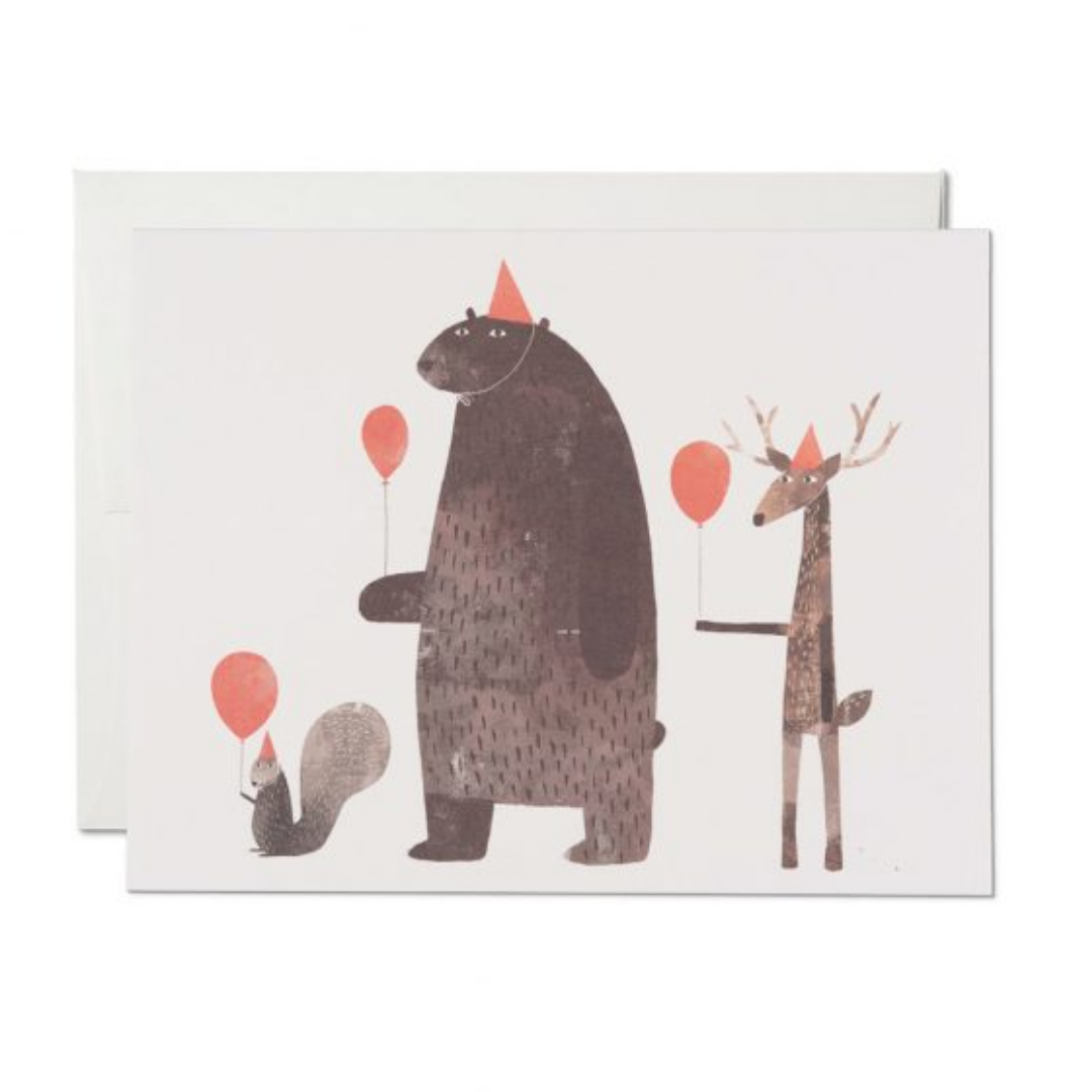 Birthday card featuring a brown bear, deer and cat with balloons and confetti accents