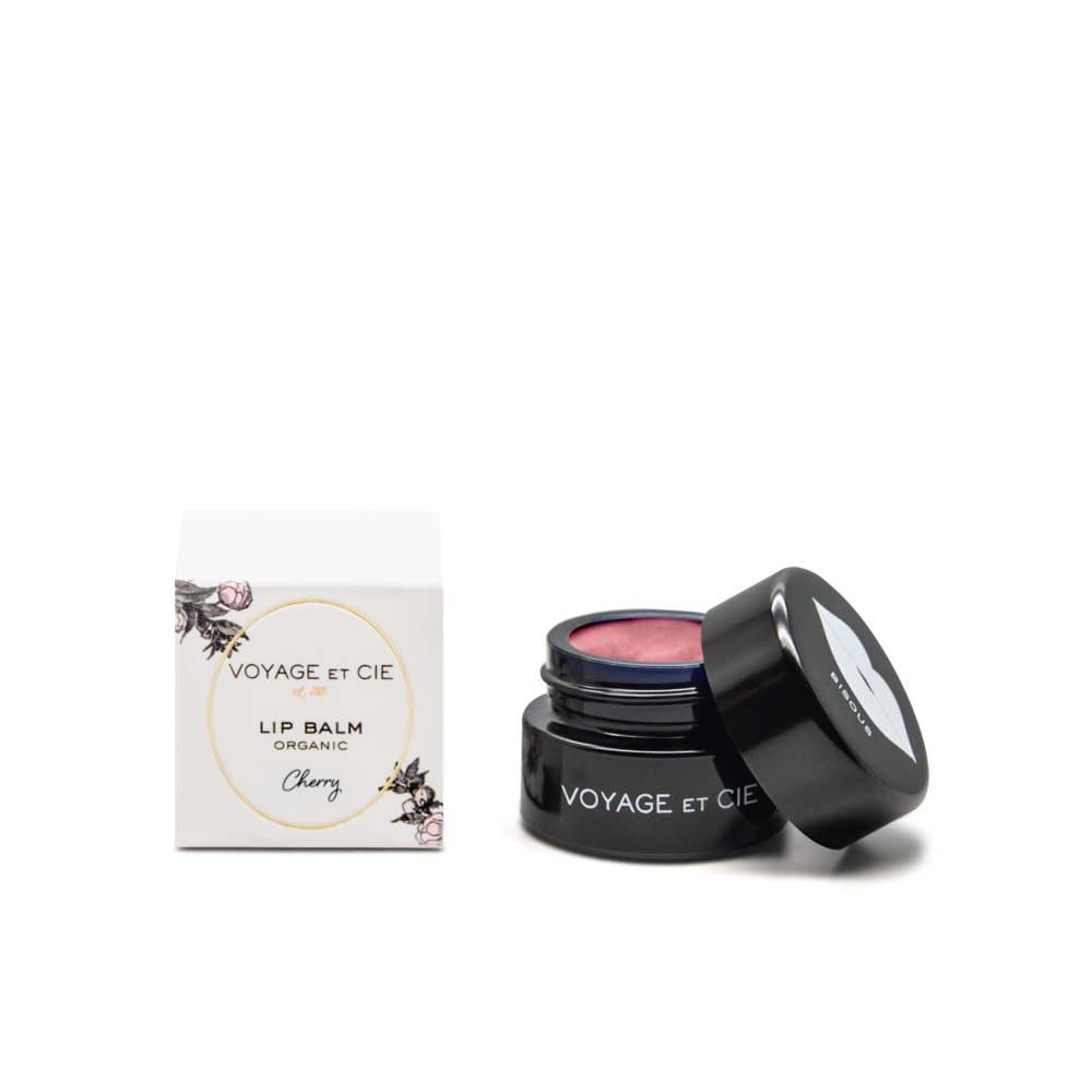 Organic lip balm jar, open lid showing pink balm; Cherry flavor