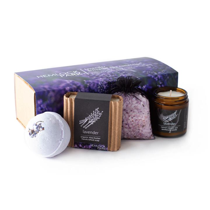 Spa gift set with lavender candle jar, bath bomb, bath soak pouch, and soap bar