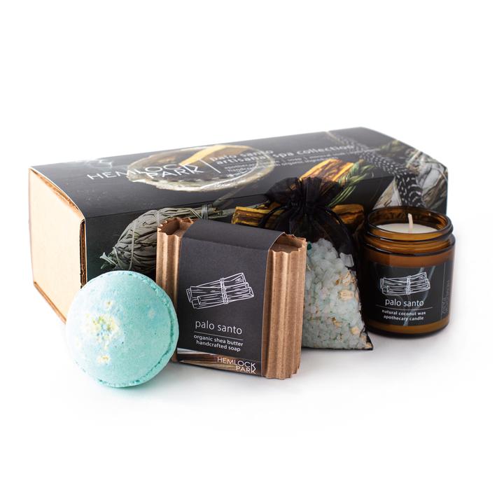Spa gift set with palo santo candle jar, blue bath bomb, bath soak pouch, and soap bar