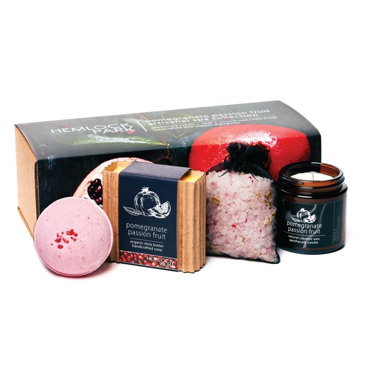 Spa gift set with pomegranate passion fruit candle jar, pink bath bomb, bath soak pouch, and soap